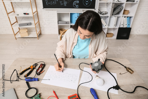 Female inventor with comput...