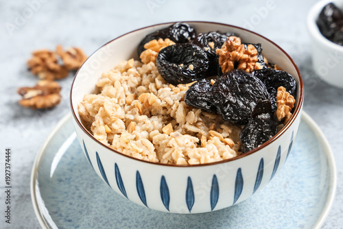 Bowl of tasty oatmeal with ...