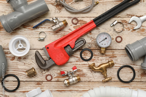 Fotografie Composition with plumber's items on white wooden background