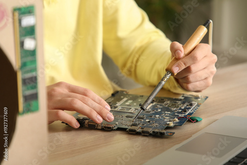 Male inventor soldering com...