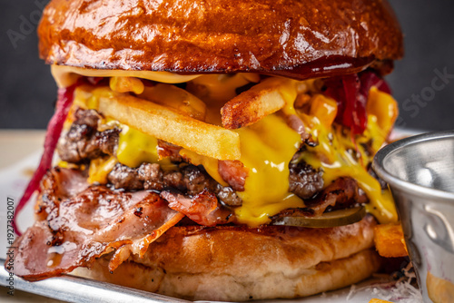 Fotografie Loaded Beef Burger With Bacon And Melted Cheese