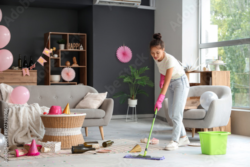 Young Asian woman mopping f...