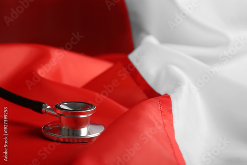 Modern stethoscope on flag ...