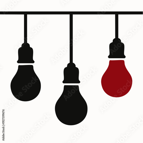 Three hanging light bulbs with one red bulb standing out