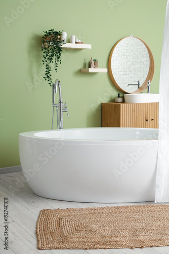 Bathtub with curtain and ch...