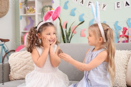 Surprised little girl recei...