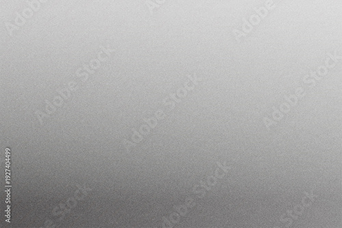 Photos Gentle gray grainy gradient subtly deepening toward one side, offering a neutral, understated backdrop suited for typography, product showcases, and refined contemporary layouts