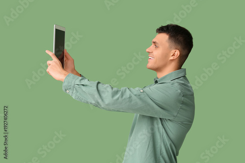 Young man with tablet compu...