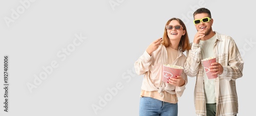 Young couple in 3D glasses ...