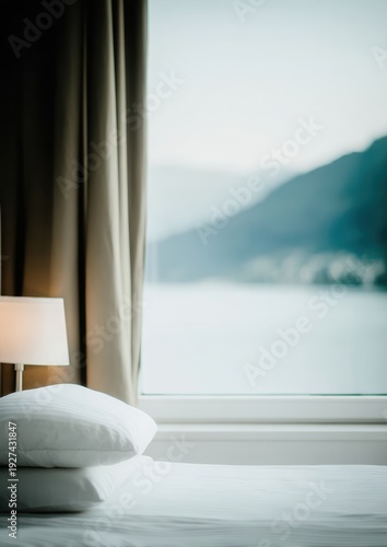 Luxury hotel guest room with white bed and large window overlooking a lake. Scenic mountain view, morning light, hospitality interior, boutique stay, peaceful bedroom atmosphere, minimalist travel.