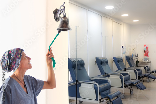 Woman ringing the bell in the chemo room