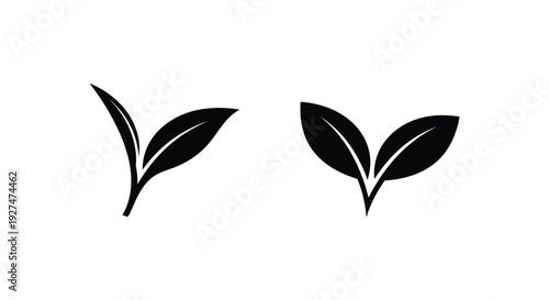 Two black silhouettes of leaves against a plain white background