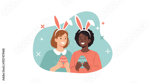 Two happy and diverse young women wearing bunny ears and holding decorated Easter eggs, celebrating the spring holiday together.