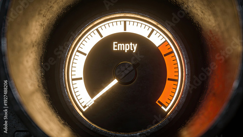 Close up of car fuel gauge showing empty, with glowing red warning indicator, emphasizing urgency and need for refueling. gauge is set against metallic background