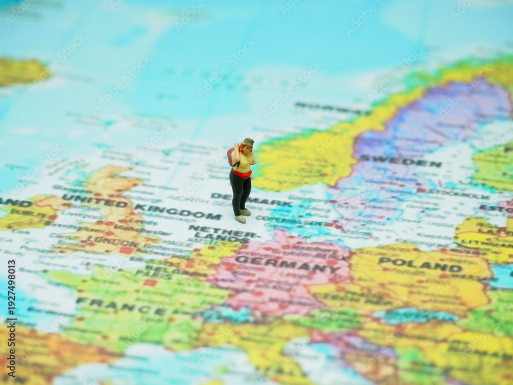 Obraz premium Miniature toy with blurred map as a background.