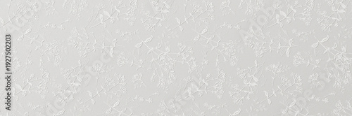 Quadro su tela A subtle white embossed floral pattern with delicate leaves and blossoms creating an elegant textured wallpaper background