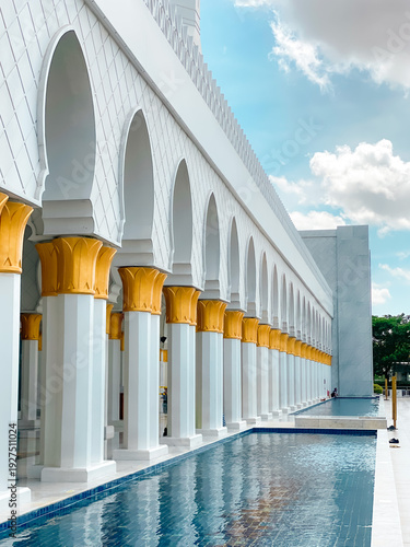 Solo, Central Java, Indonesia - January 3, 2026 - Beautiful view of Sheikh Zayed Grand Mosque Solo on a sunny morning with blue sky in the background.