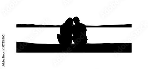 Romantic couple sitting together on beach at sunset