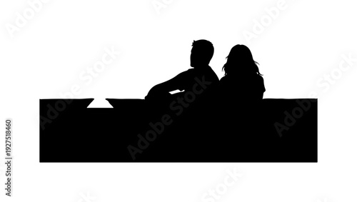 Couple sitting together in relaxed mood at modern table
