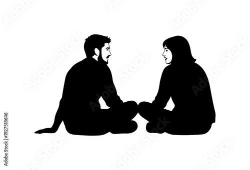 Couple sitting together in relaxed pose facing each other
