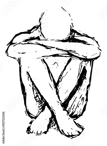 Person sitting alone in contemplation with arms wrapped around knees