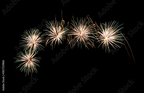 Green and yellow firework sparkling on black background for celebration and anniversary