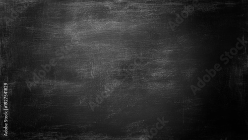 Chalkboard Wall Texture. A black or dark gray chalkboard surface with a slightly rough texture,