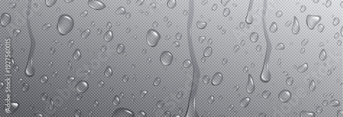 A close-up view of raindrops on a textured gray surface