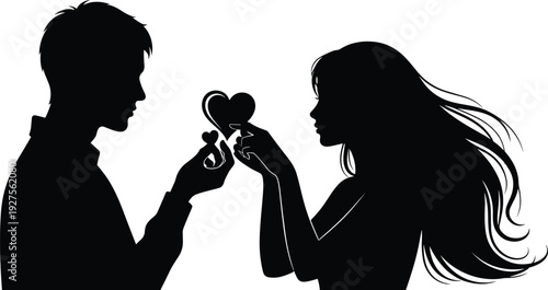 Silhouette of a romantic young couple in love holding heart shapes facing each other isolated on a white background