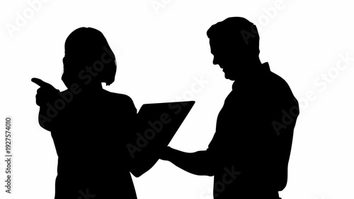 Business professionals discussing documents together