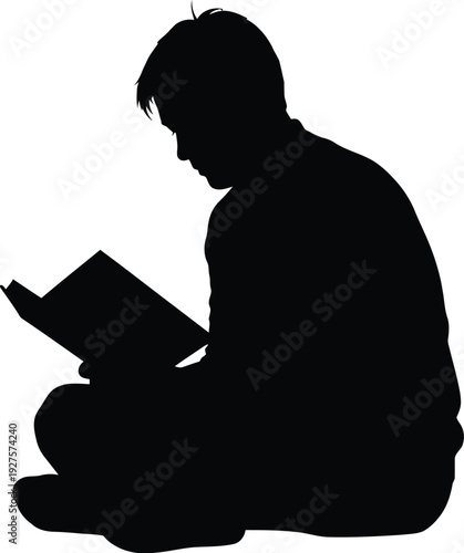 Silhouette of a person reading a book while sitting cross legged