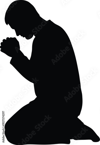 Silhouette of a person kneeling in prayer or meditation