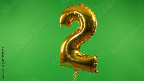 Golden Number Two Balloon Floating on Green Screen Background
