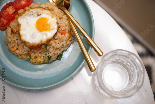 fried rice with egg and fresh cucumber slices