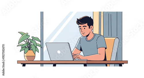 Young man working on a laptop computer at a desk.