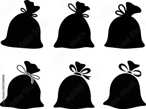 Six black bags with tied tops arranged in two rows