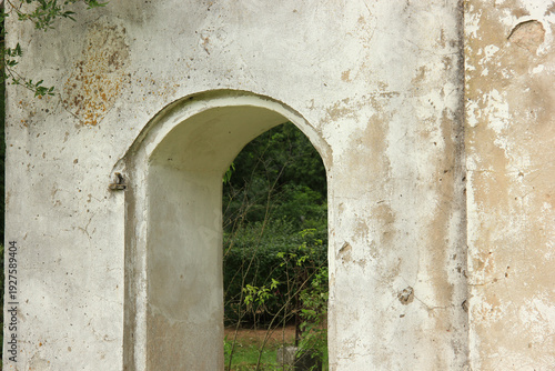 Weathered Archway in a Crumbling Stone Wall