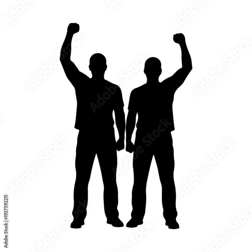 Silhouette of Two Men with Raised Fists.