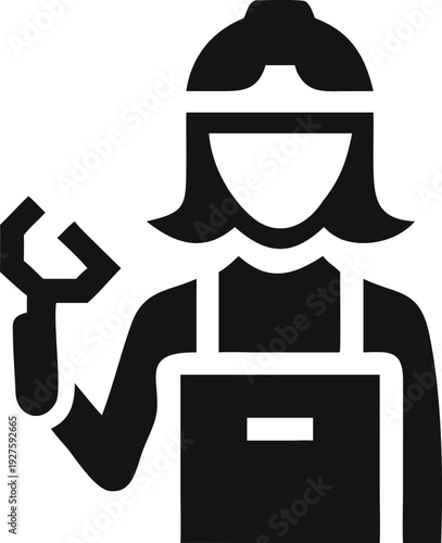 Female industrial worker in a hard hat and apron holding a large wrench for tough jobs