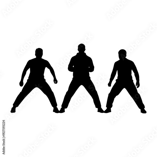 Silhouette of Three Men in a Dynamic Stance.