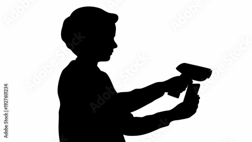 Silhouette of a man using a smartphone and credit card
