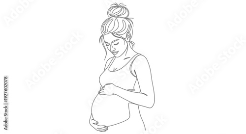 A pregnant woman gently touches her belly with love and care indoors.