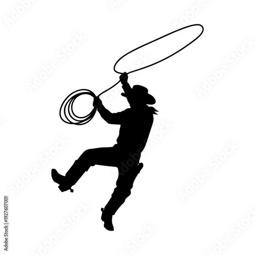Silhouette of a Cowboy Swinging a Lasso.