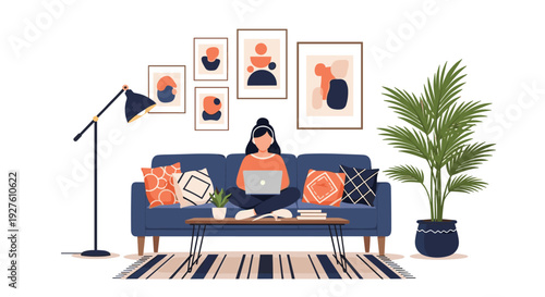Young woman works on her laptop while sitting cross legged on a blue sofa in a cozy and modern decorated living room.