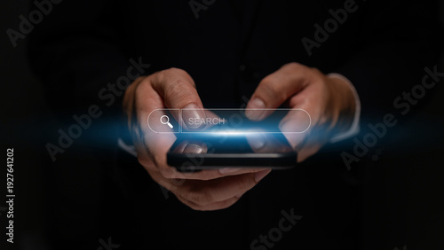 Wallpaper Mural Business professional using smartphone with virtual search interface, browsing online information and managing digital tasks in a secure and connected environment. Torontodigital.ca