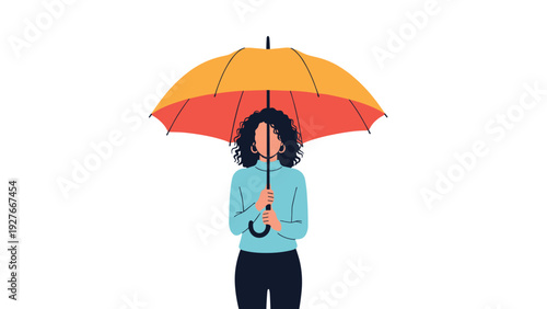 Woman standing behind large orange and yellow umbrella that completely covers her face and upper body.
