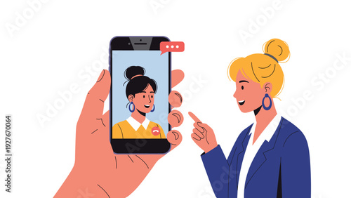 Close up of a hand holding a smartphone during a video call with a woman pointing at the screen and smiling.