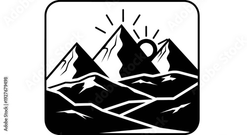 Majestic mountain peaks with a radiant sunrise or sunset behind them