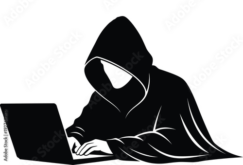 Silhouette of a hooded figure working on a laptop computer