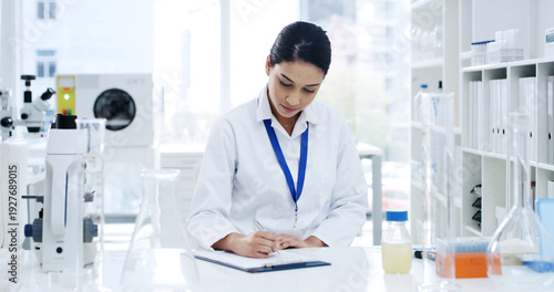 Fotografie Scientist, document and woman with medical research, writing and healthcare for notes in laboratory